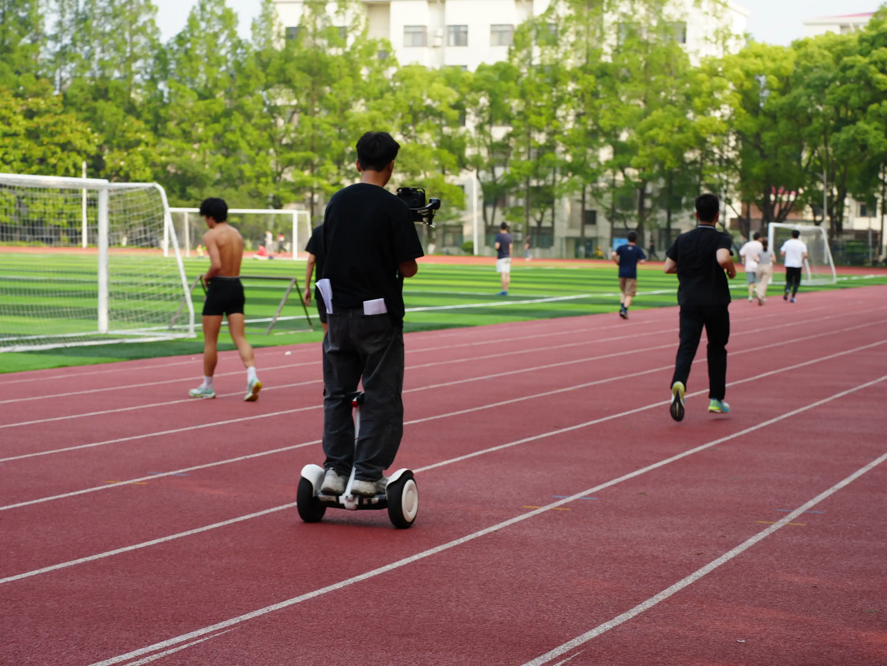Protagonist runs on the track as the cameraman follows
