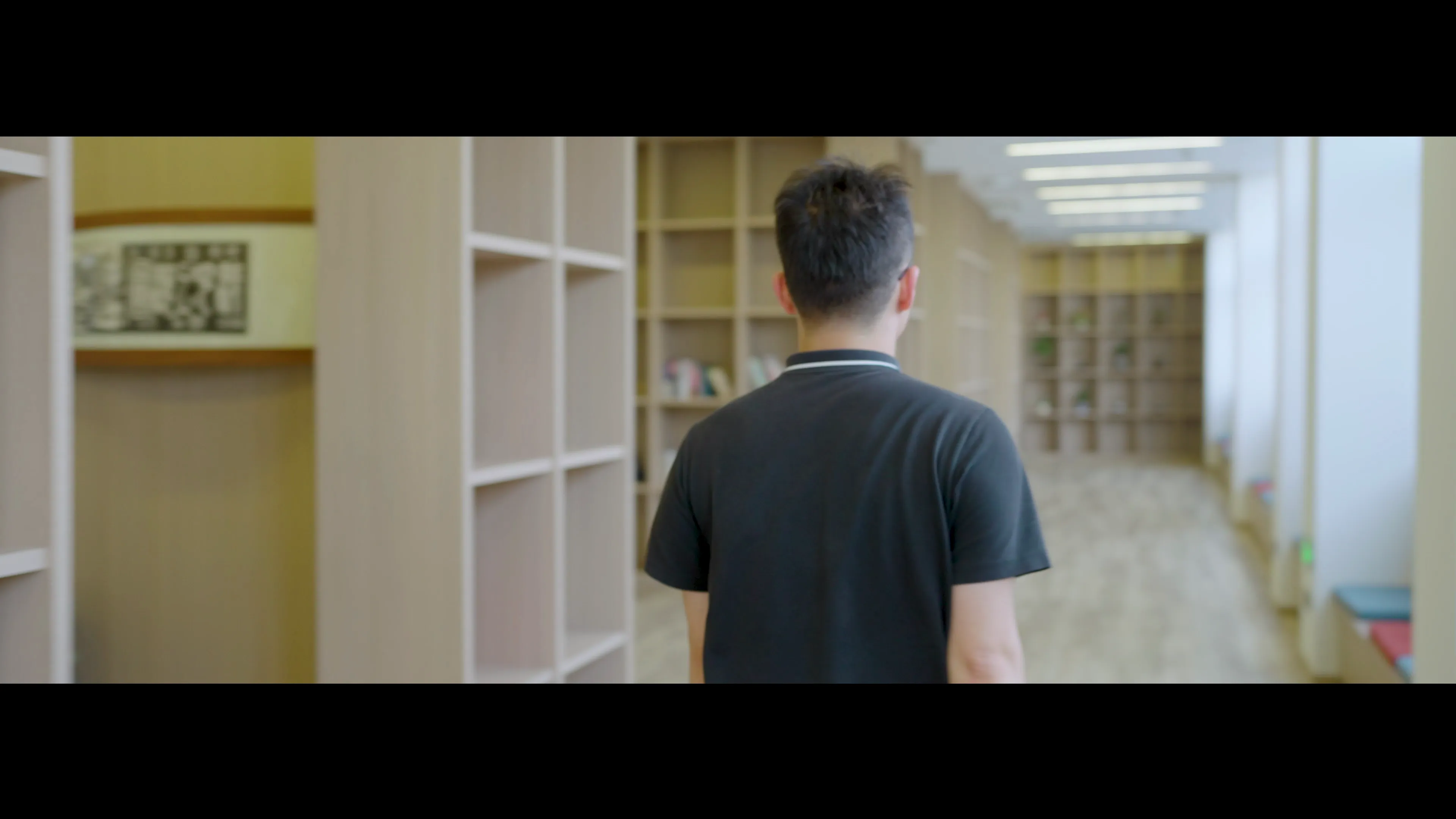 Protagonist walks quickly down the corridor